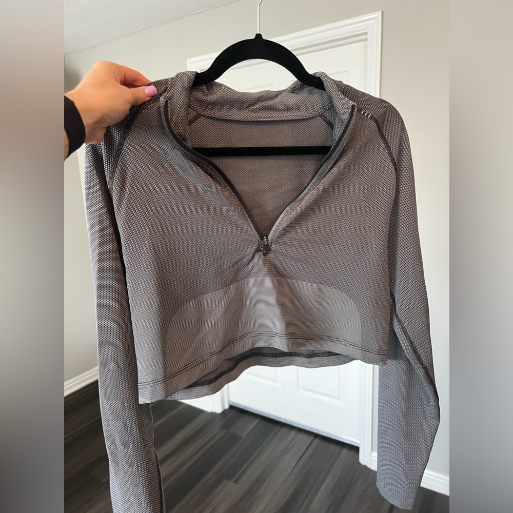 Lululemon cropped long sleeve- Men’s size S/ warn women’s size medium